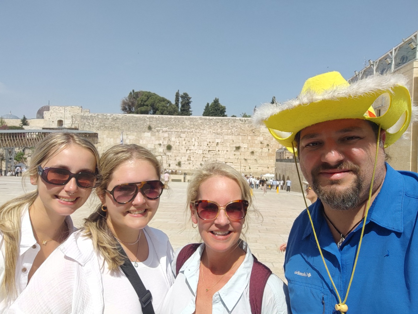 Group of guests with their guide in the yellow hat at the Western Wall, Jerusalem