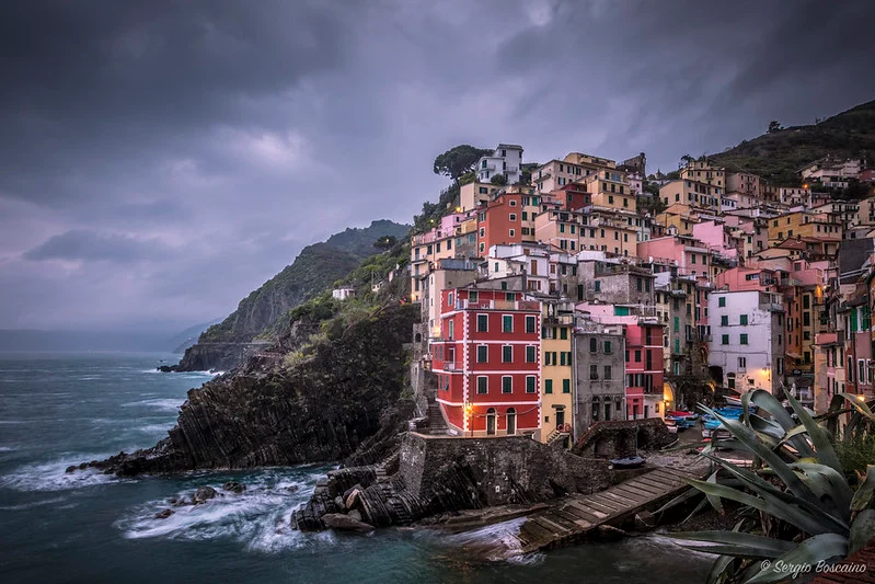 Riomaggiore harbor and pastel houses at dusk