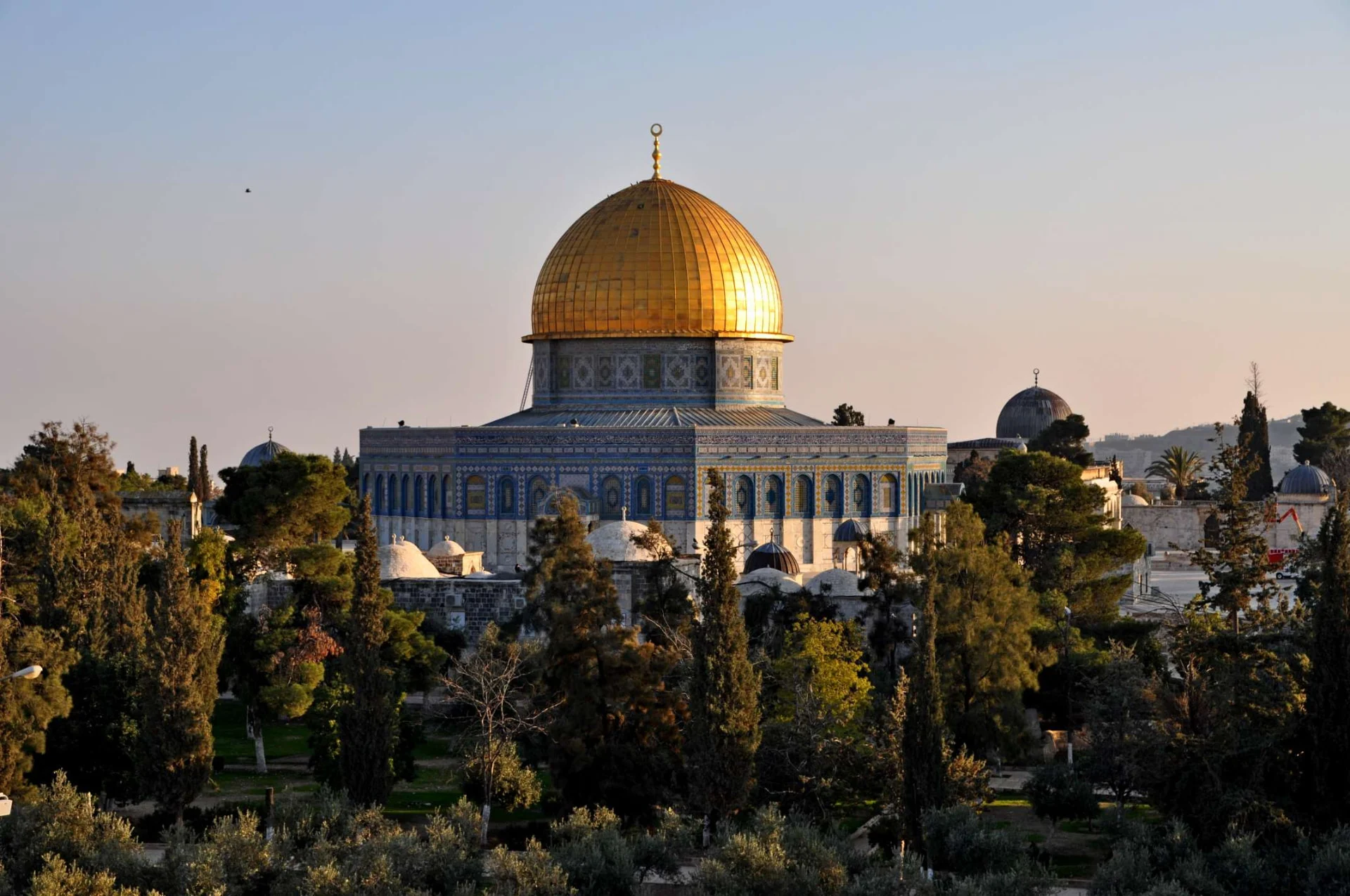 Dome of the Rock glowing at sunrise over Jerusalem's Old City