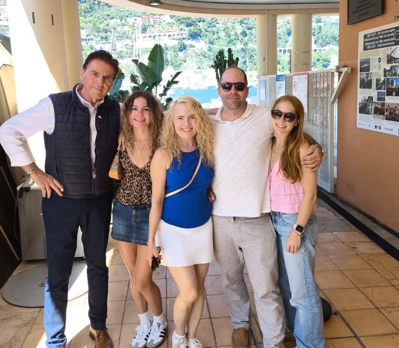 Happy family group with their private driver-guide above the bay of Villefranche on the French Riviera