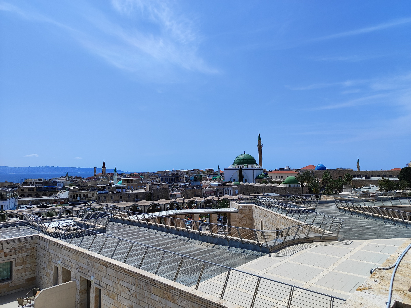 Panoramic view of old Acre's skyline with the green-domed Al-Jazzar Mosque and minaret above the Mediterranean Sea