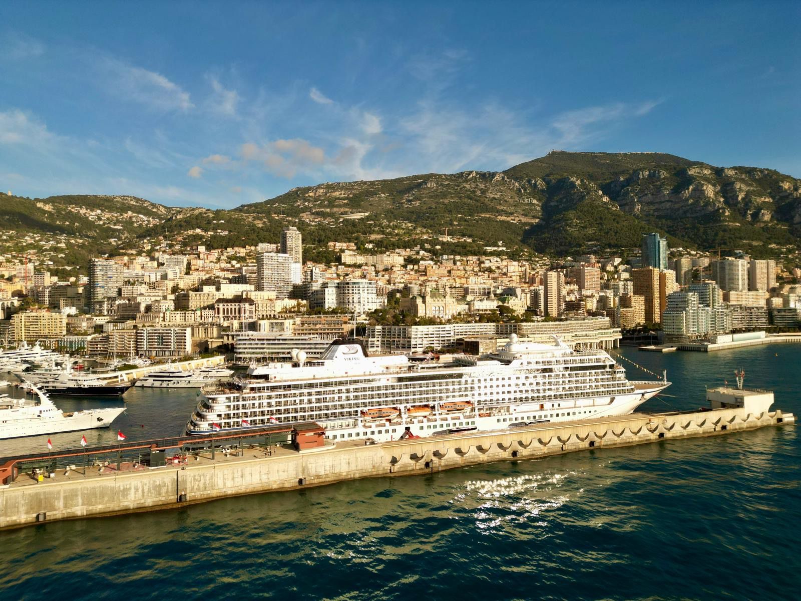 Cruise ship and luxury yachts docked in the Port of Monaco