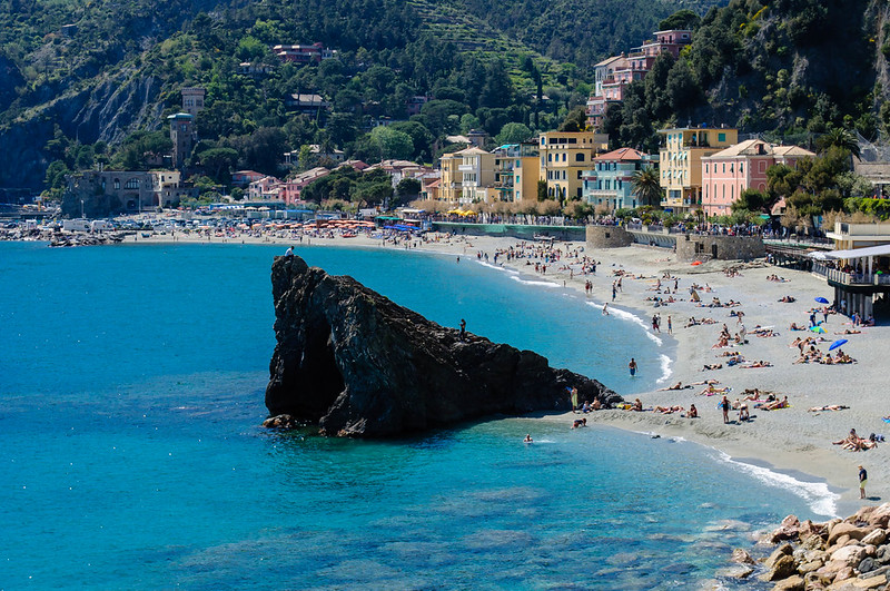Monterosso al Mare beach with its iconic rock and colorful seafront houses