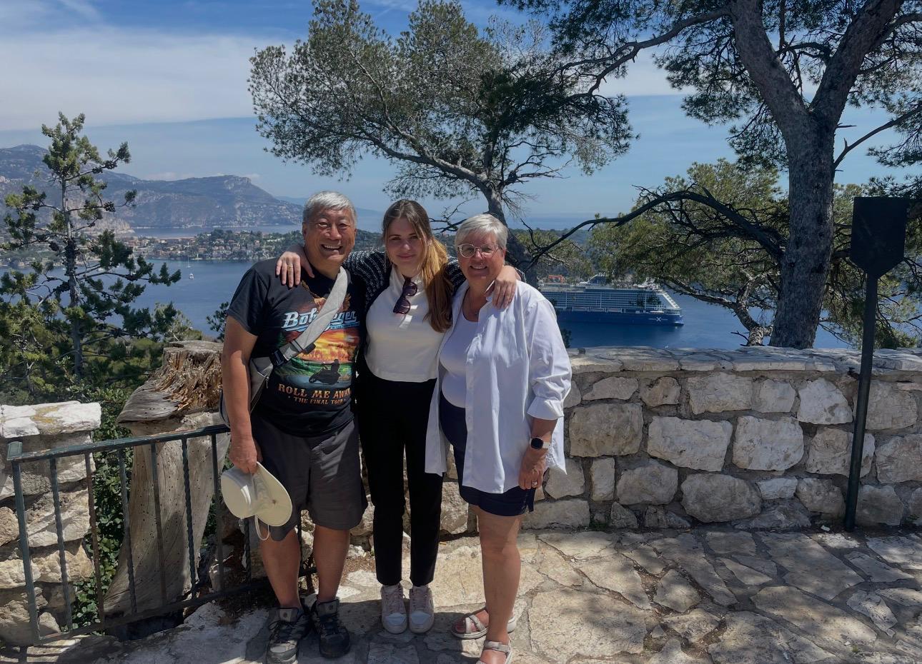 Family posing at a scenic viewpoint over Villefranche-sur-Mer