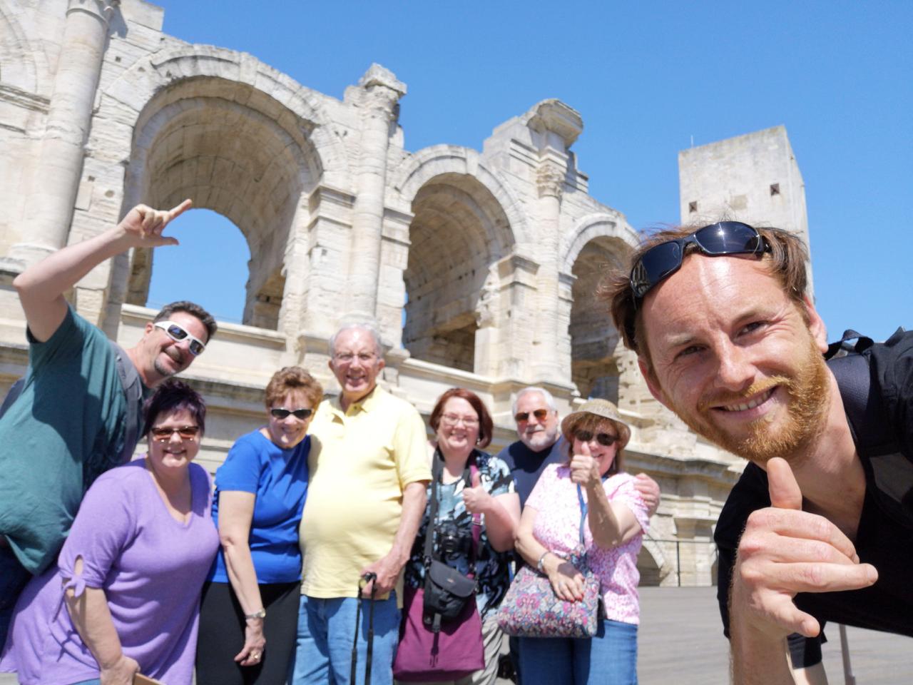 Tour group selfie at the Roman amphitheatre in Arles