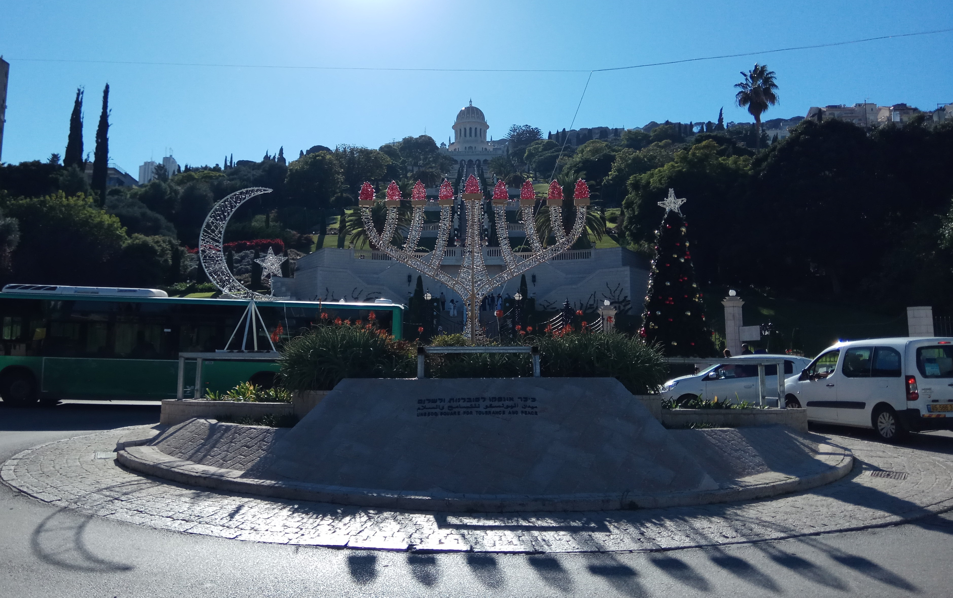 Bahá'í Gardens and coexistence symbols at German Colony