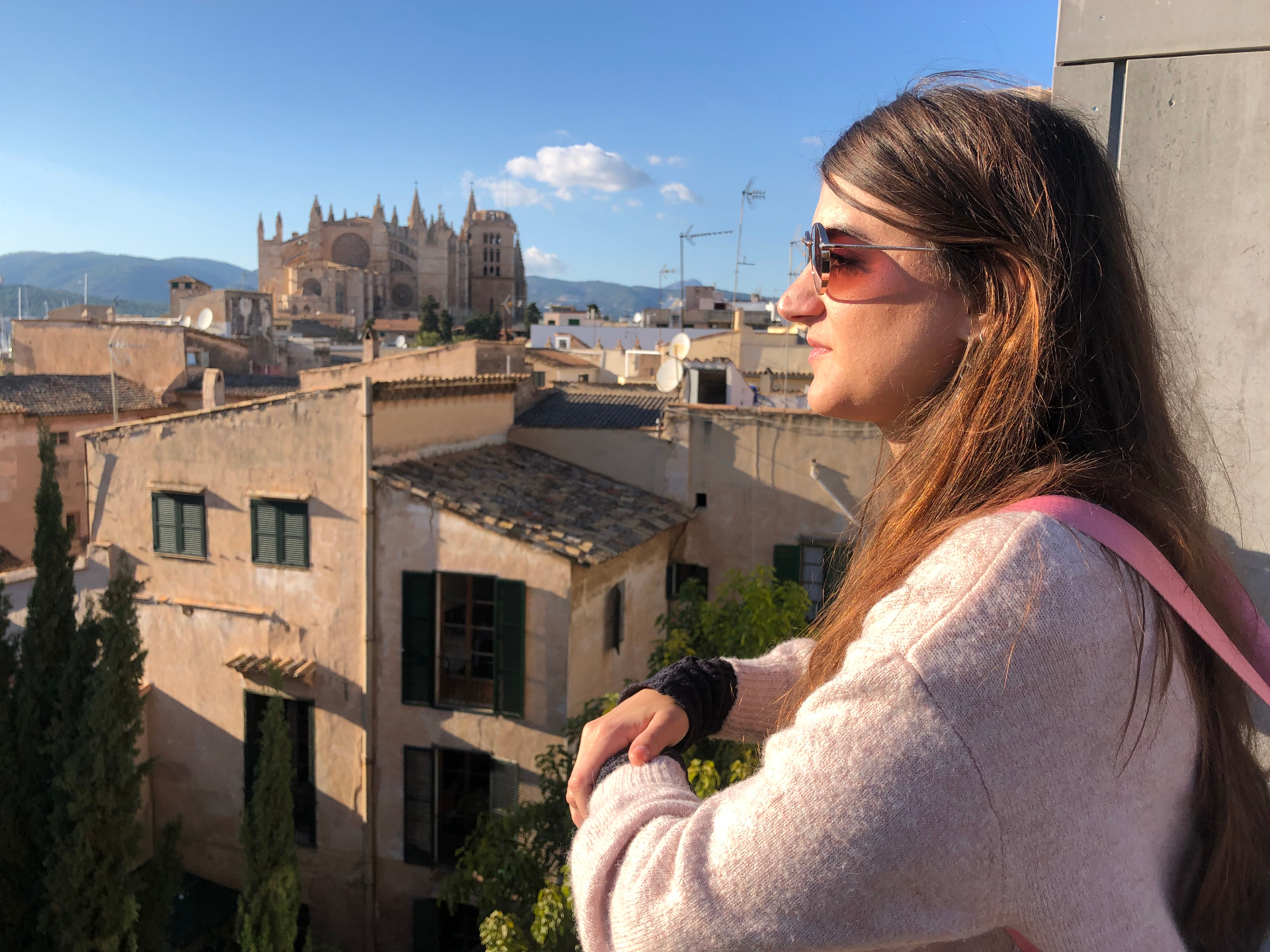 Traveler enjoying rooftop view of Palma Cathedral