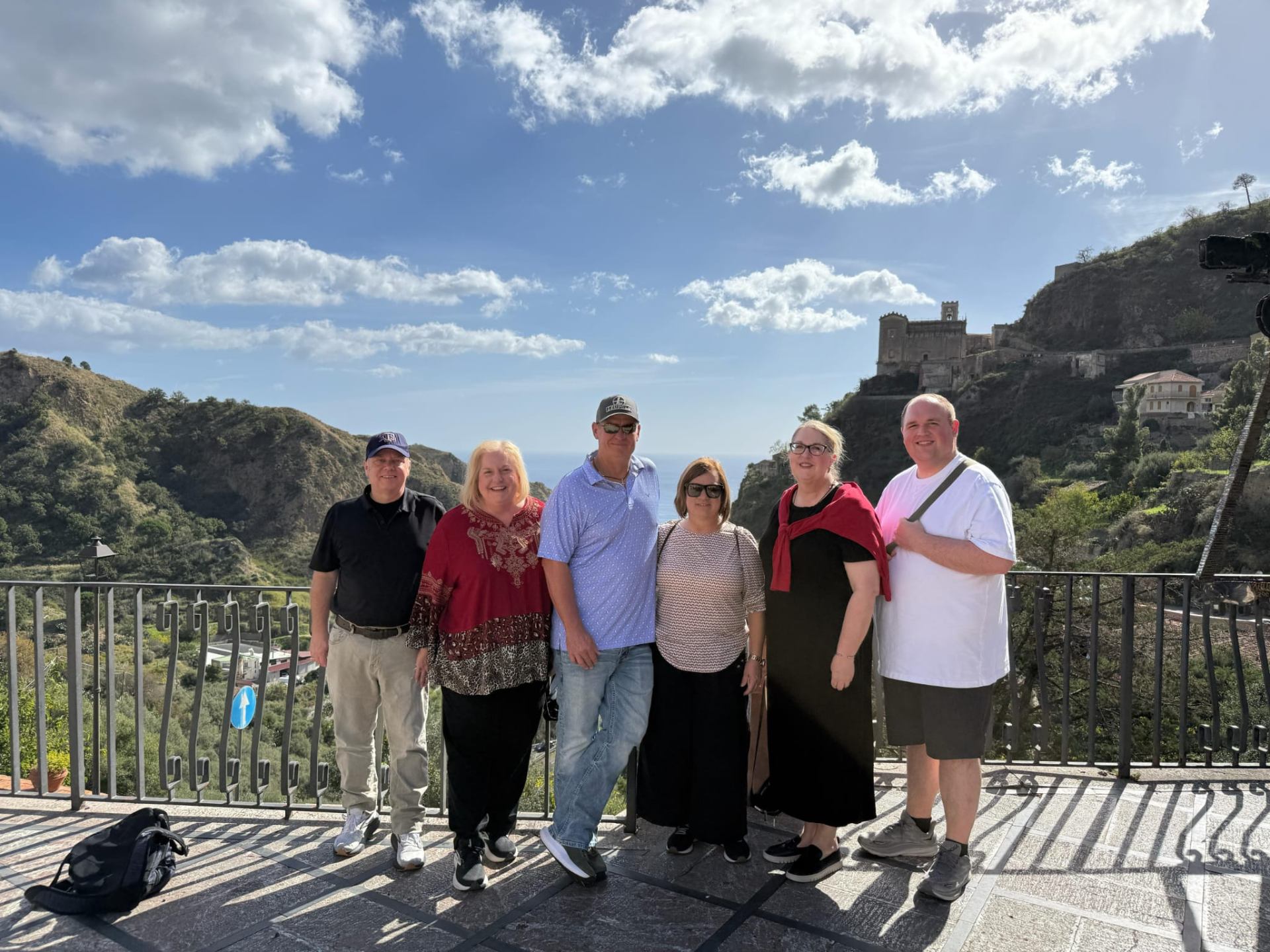 Tour group at Savoca viewpoint with coastal panorama