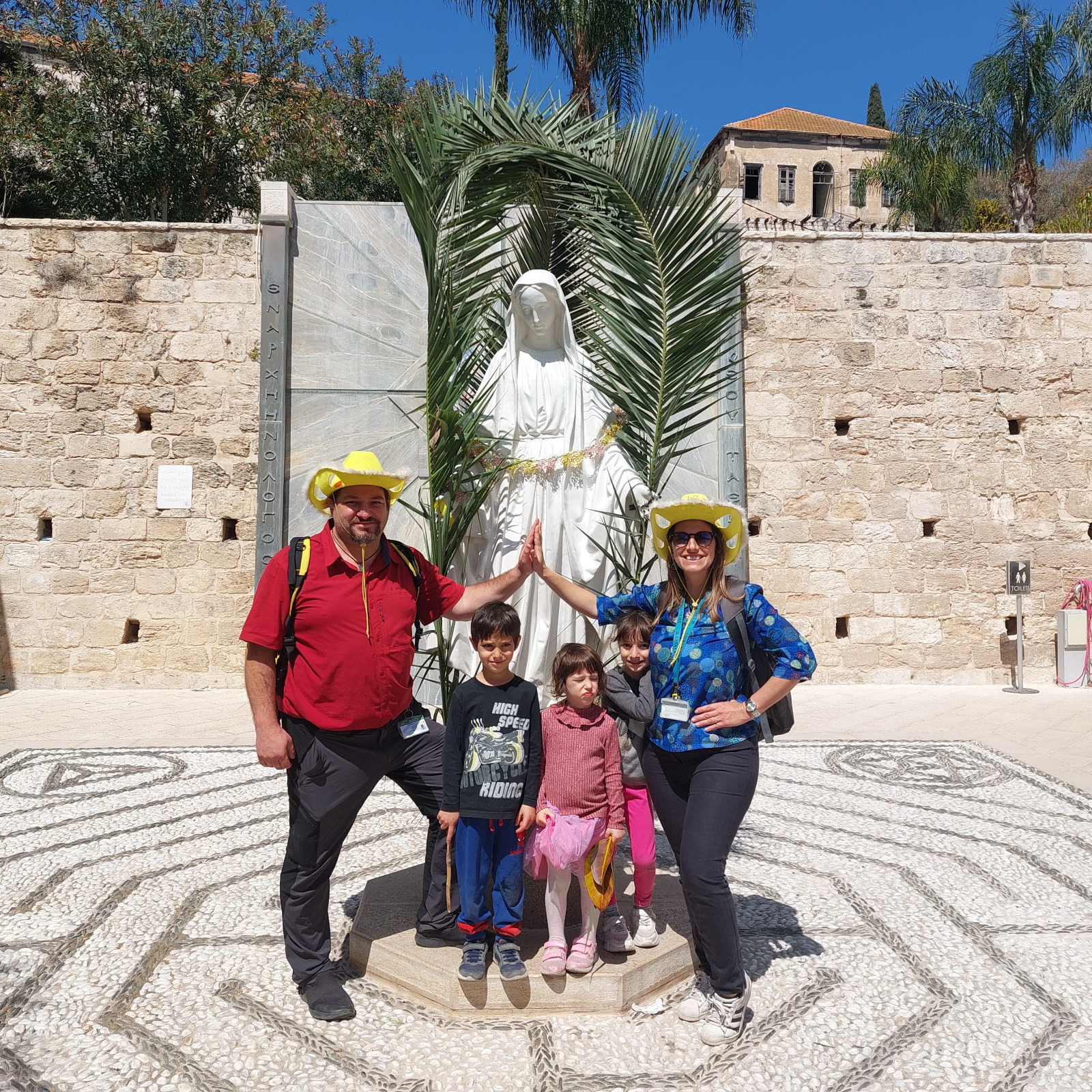 Family at Mary's statue in Nazareth