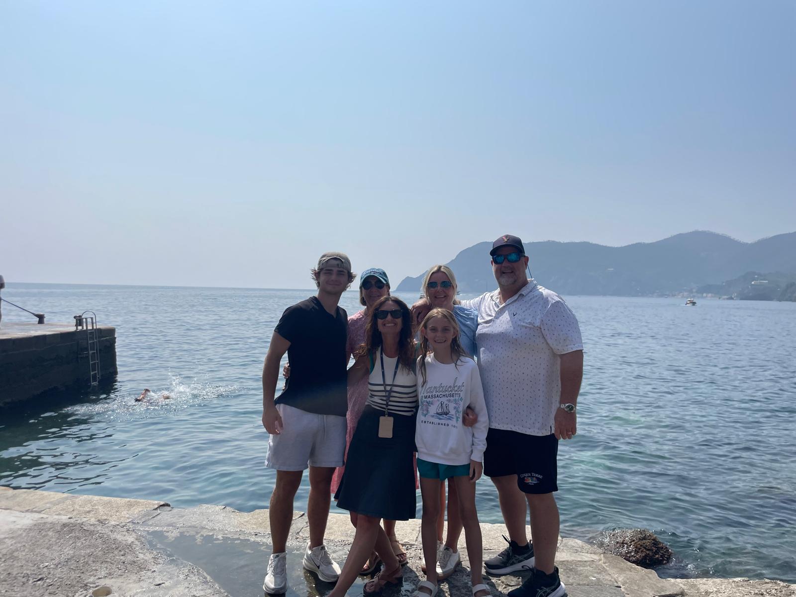 Private tour group with their driver-guide along the scenic Ligurian seaside
