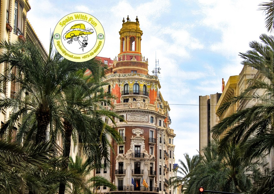 Ornate architecture on Valencia's palm-lined boulevard